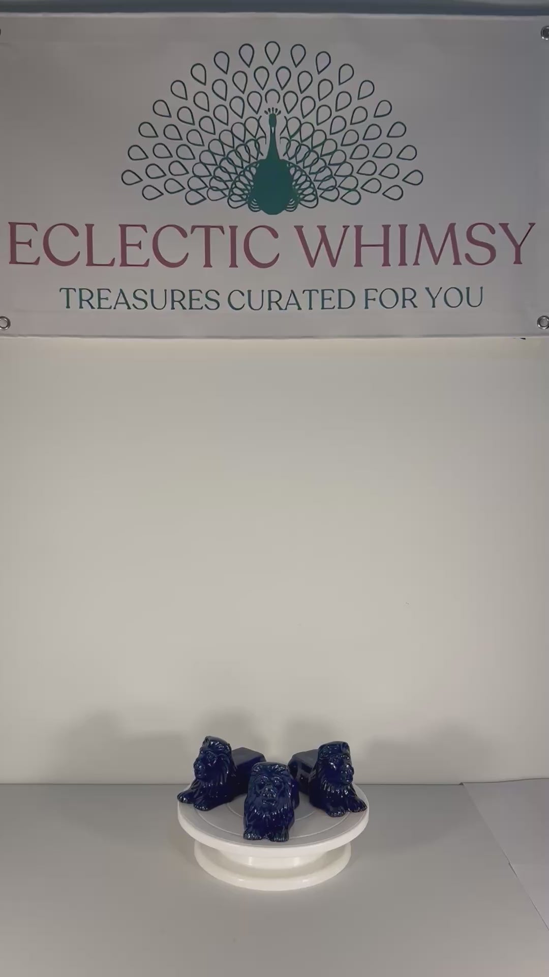 Set of three decorative terra cotta lion sculptures in a unique petroleum blue glaze.