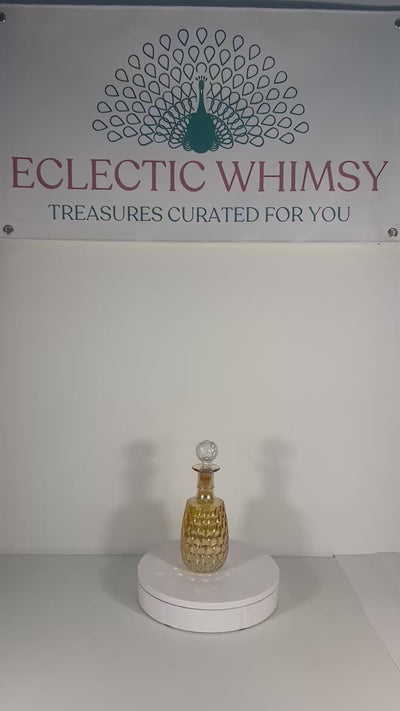 Vintage 1960s Old Forester whisky decanter in iridescent carnival glass with a textured geometric pattern.