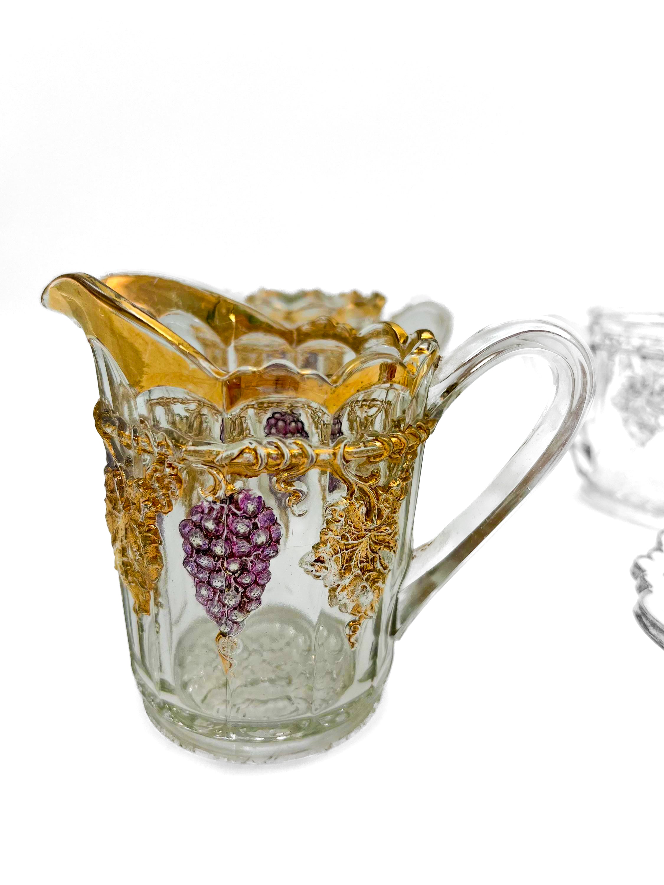 Antique Early American Pattern Glass (EAPG) brunch set featuring a detailed grape and leaf relief.Antique Early American Pattern Glass (EAPG) brunch set featuring a detailed grape and leaf relief.