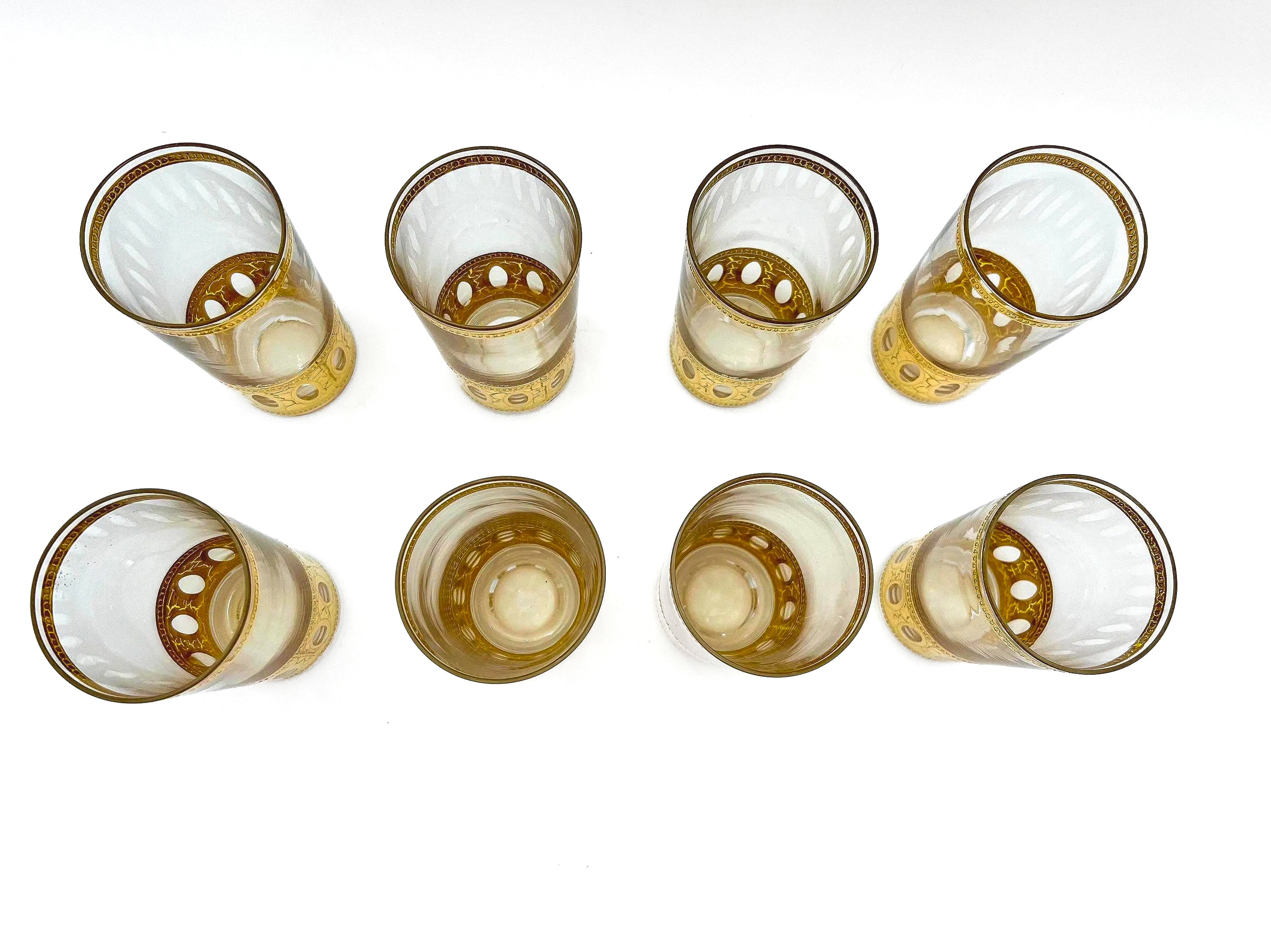 Set of 8 signed vintage Culver highball glasses featuring an intricate 22k gold geometric pattern.