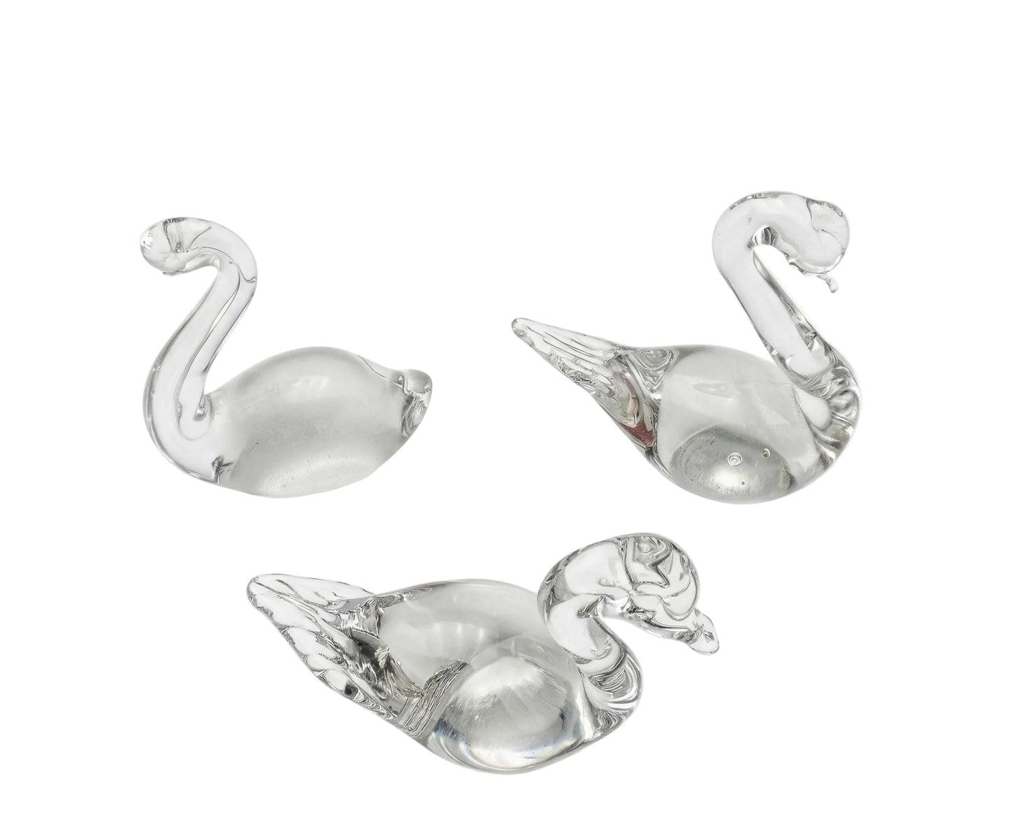 Trio of Swedish vintage art glass figurines featuring two minimalist ducks and one swan in clear hand-blown glass.