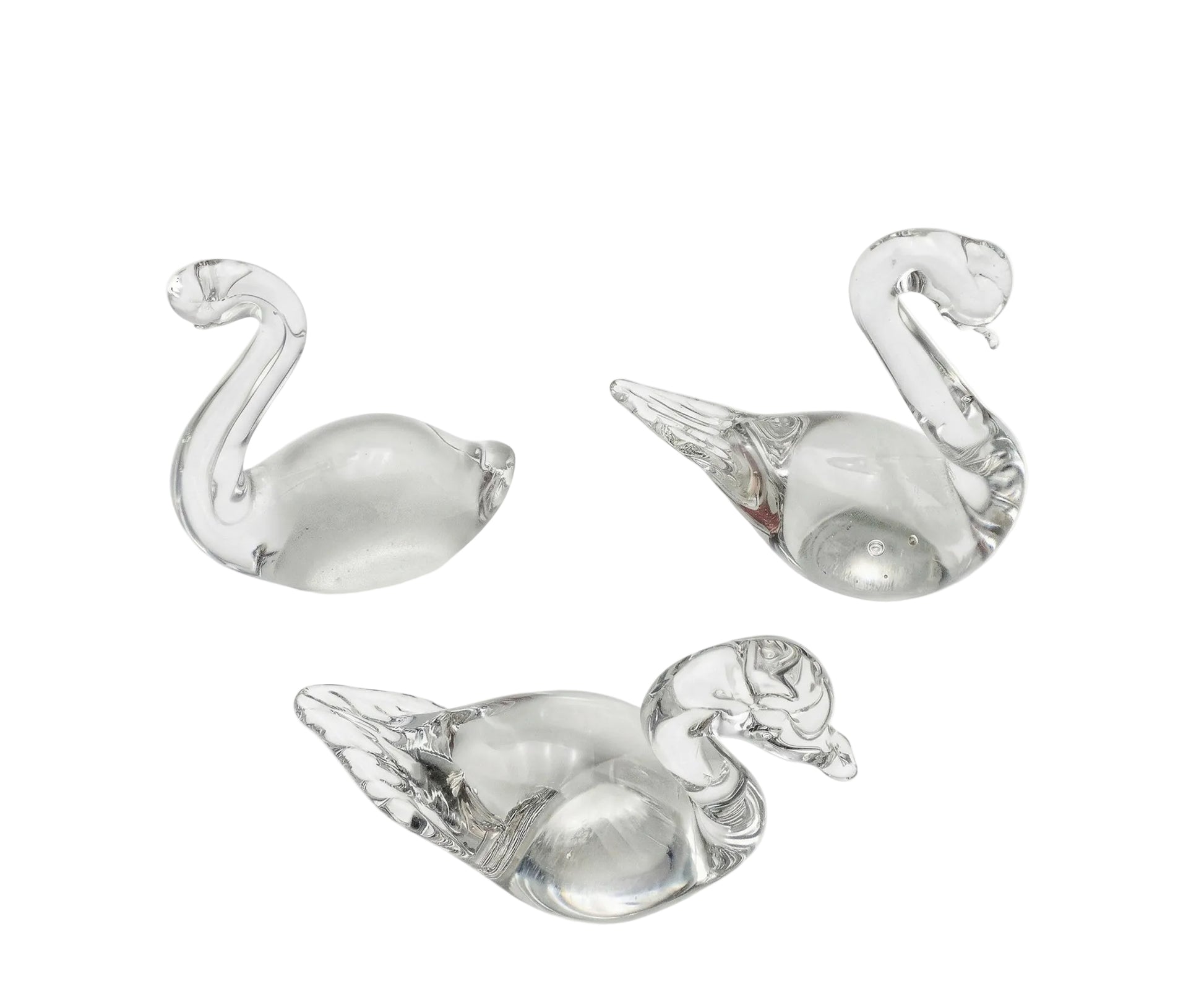 Trio of Swedish vintage art glass figurines featuring two minimalist ducks and one swan in clear hand-blown glass.