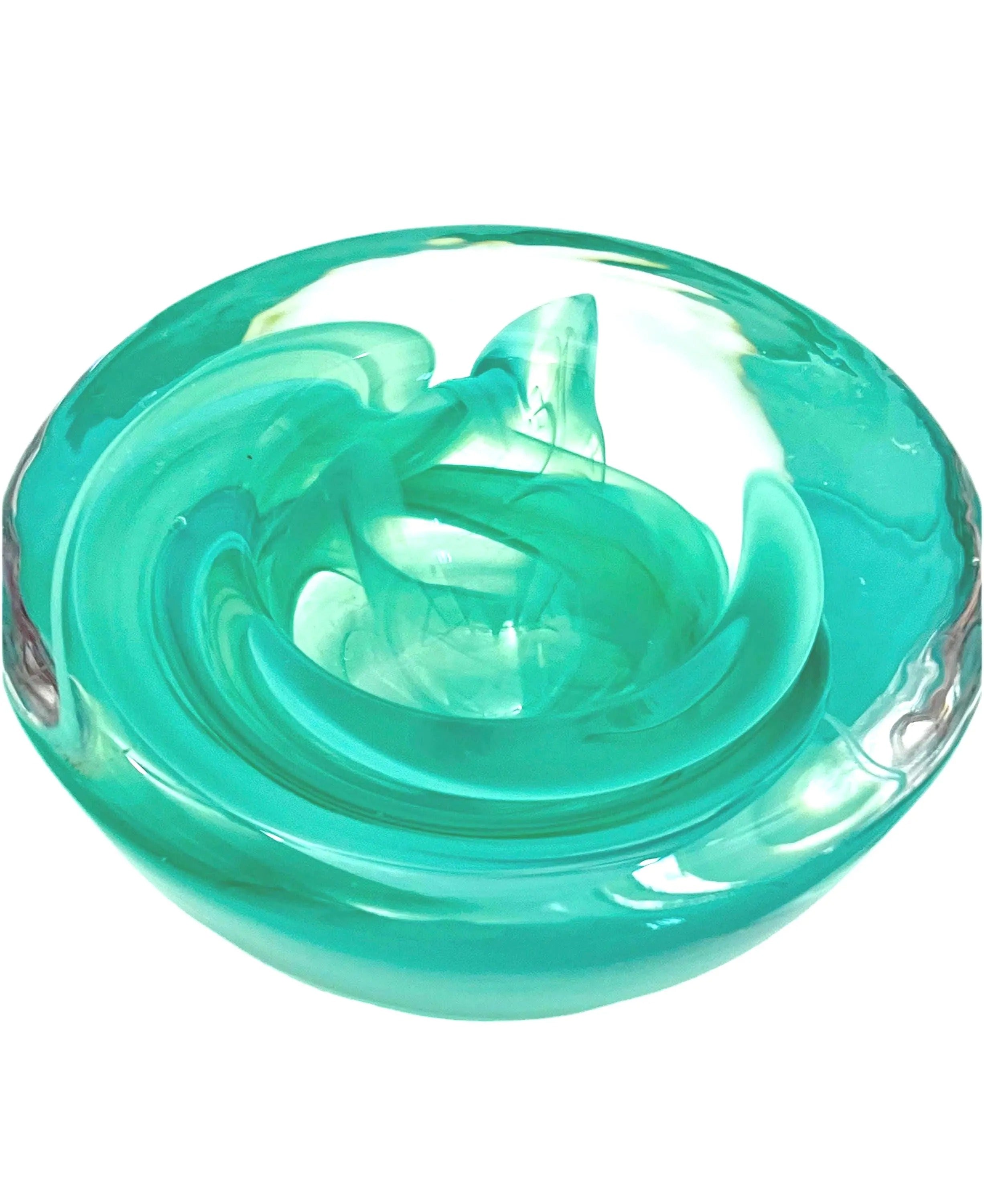 Vintage mouth-blown Kosta Boda glass tea light holder in a translucent teal color.
