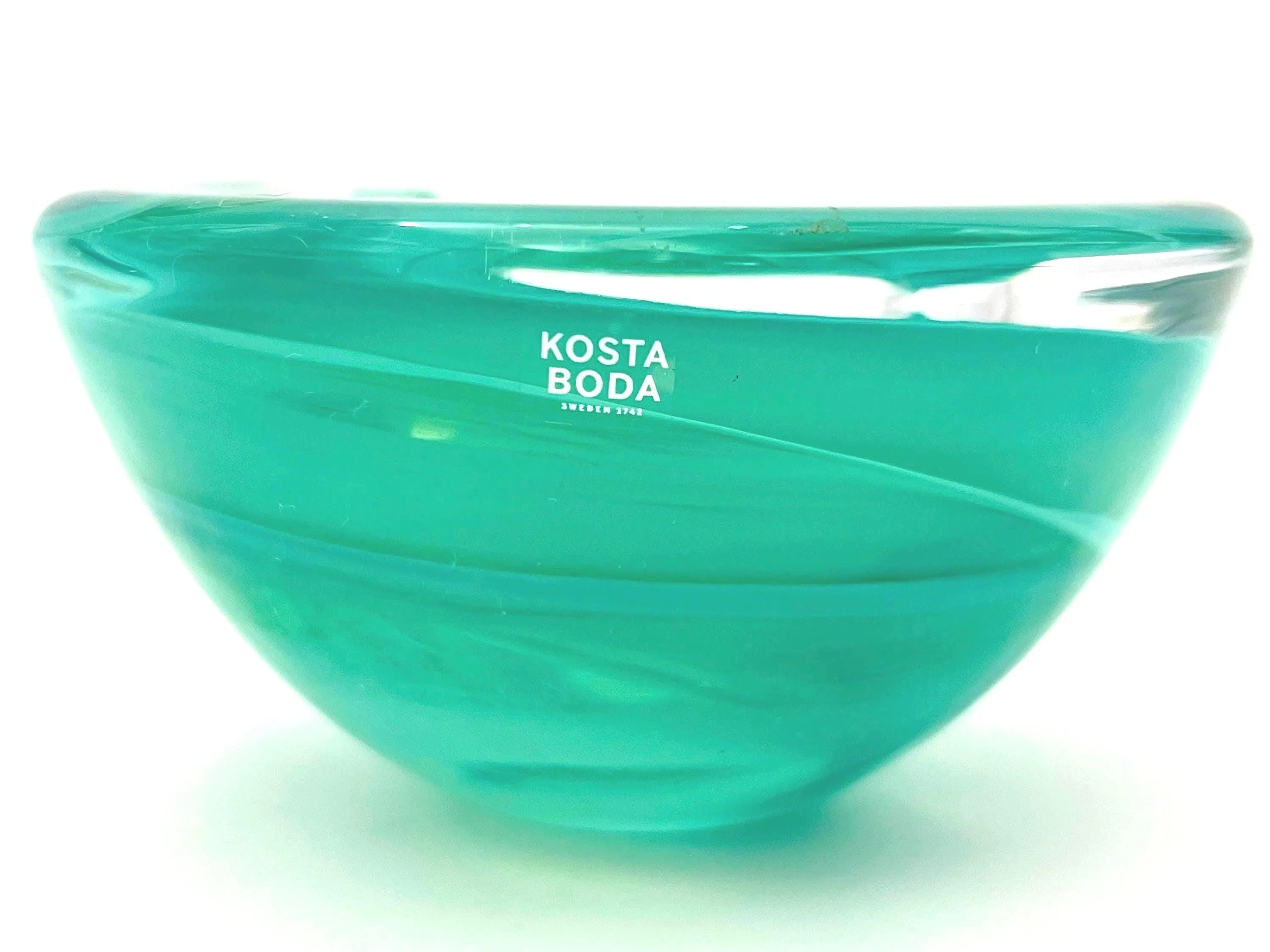 Vintage mouth-blown Kosta Boda glass tea light holder in a translucent teal color.