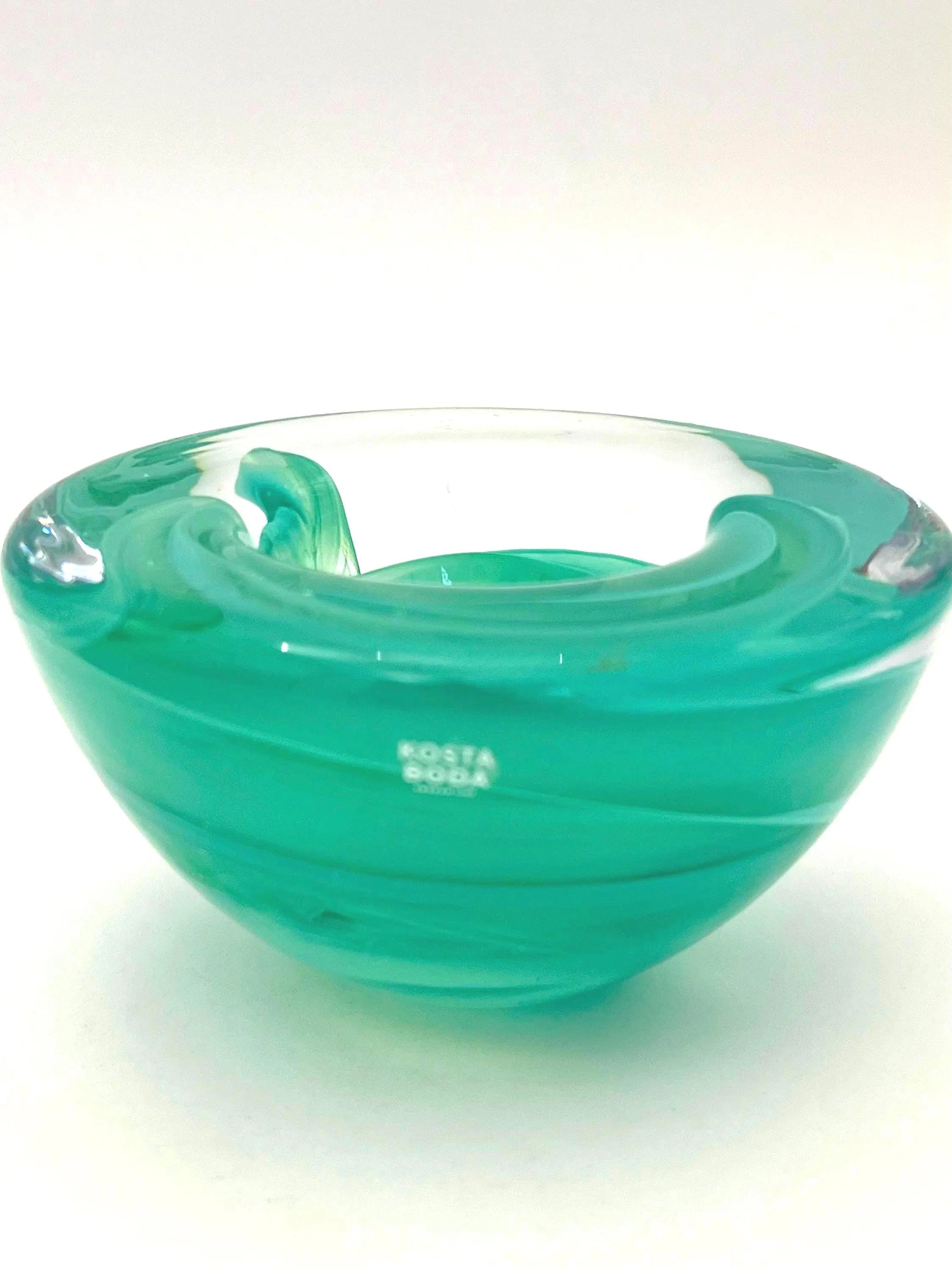 Vintage mouth-blown Kosta Boda glass tea light holder in a translucent teal color.