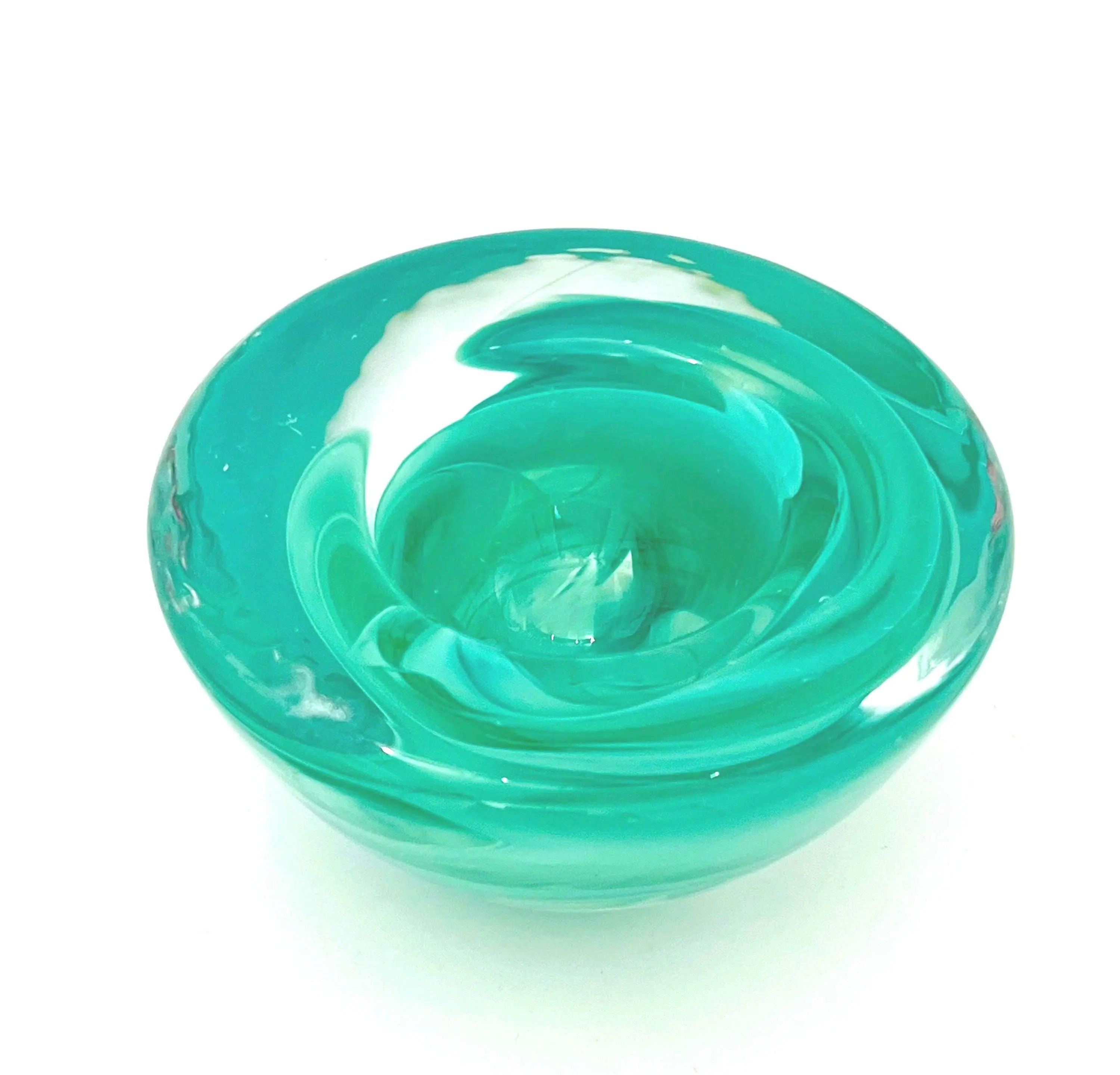 Vintage mouth-blown Kosta Boda glass tea light holder in a translucent teal color.