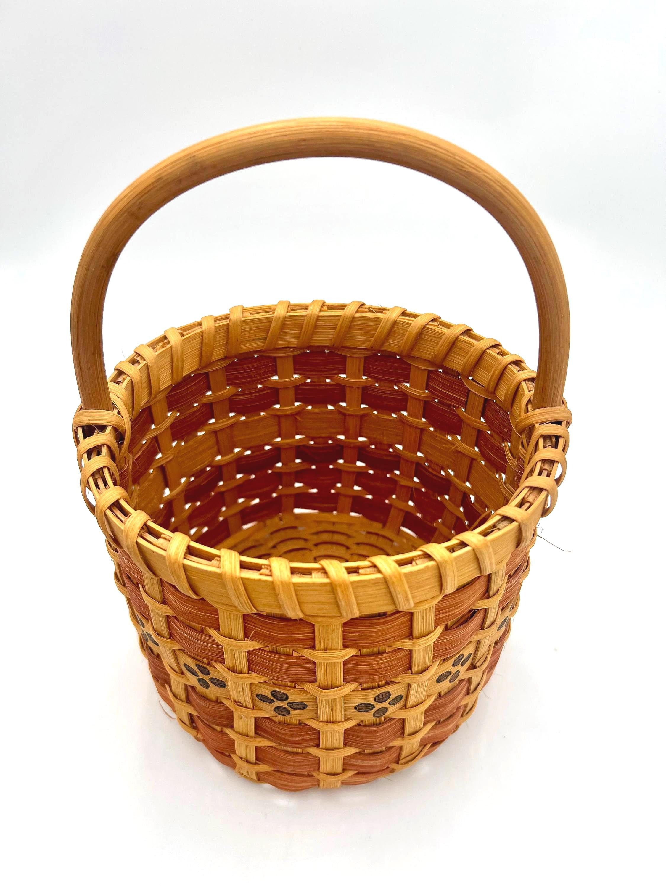 One-of-a-kind vintage artist-signed basket featuring intricate handmade weaving and natural materials.