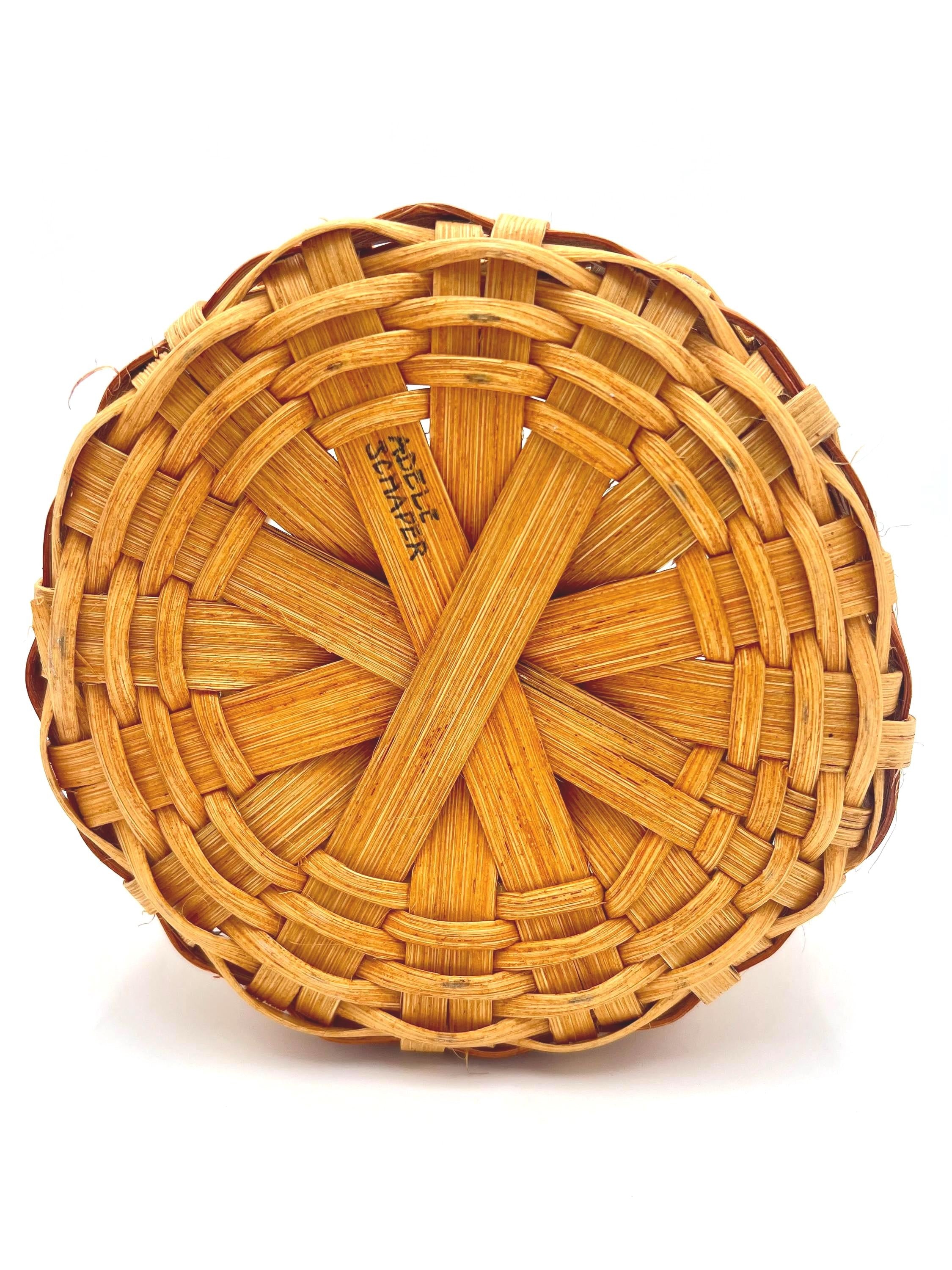 One-of-a-kind vintage artist-signed basket featuring intricate handmade weaving and natural materials.