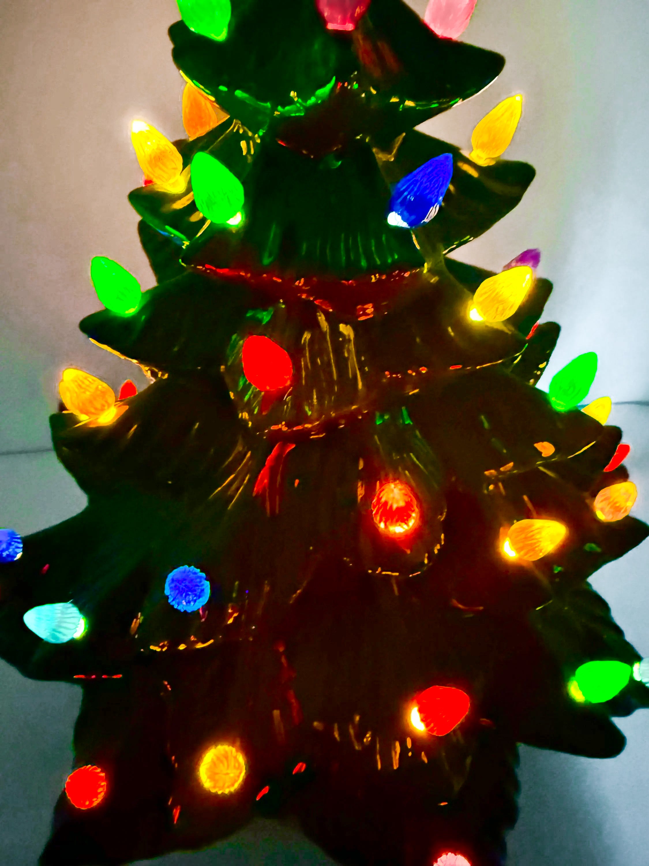 Large lighted 22-inch ceramic Christmas tree by Atlantic Mold with multicolor bulbs, star topper, and music box.