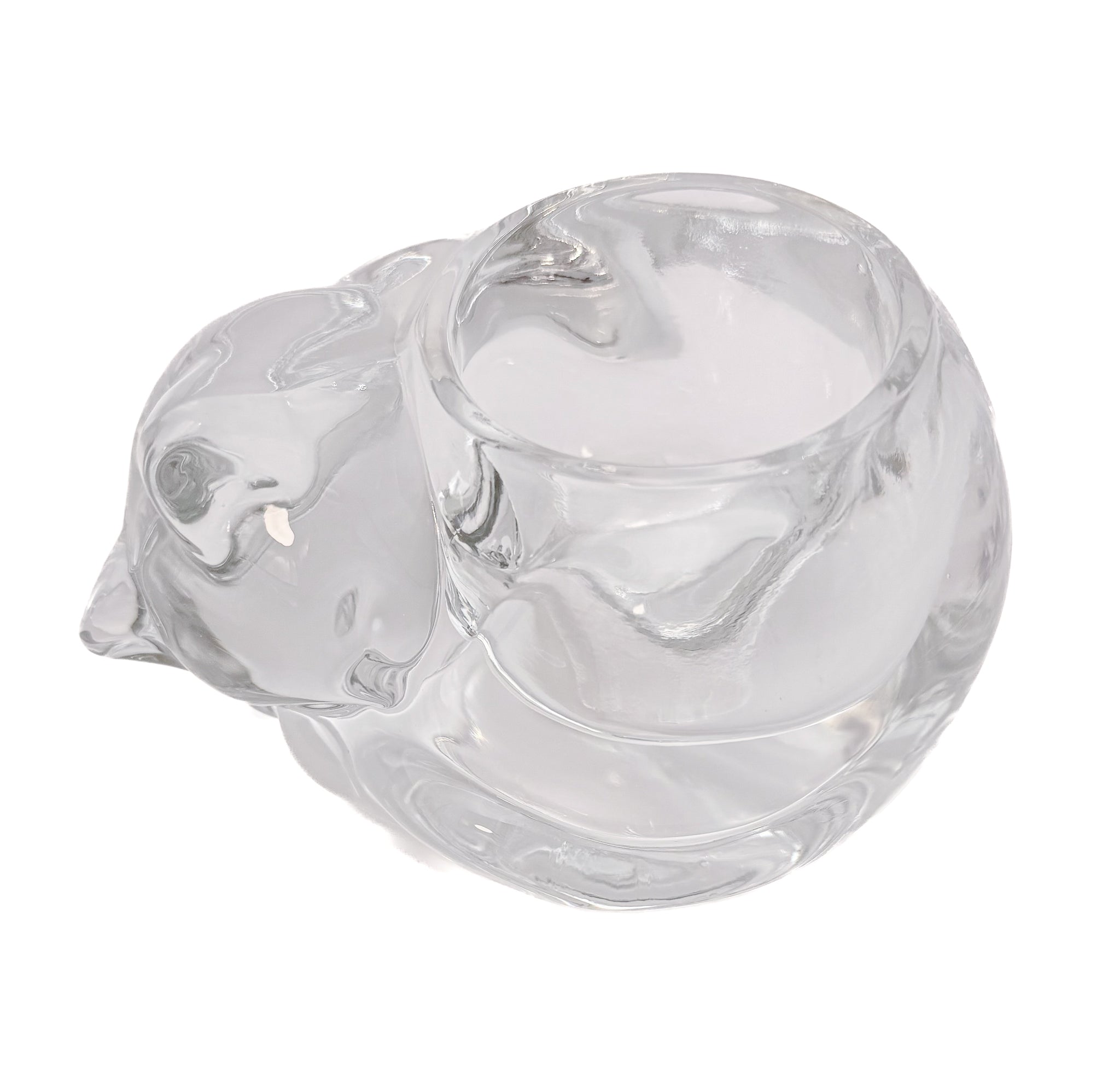 Clear molded glass votive holder shaped like a sleeping cat, vintage Indiana Glass.