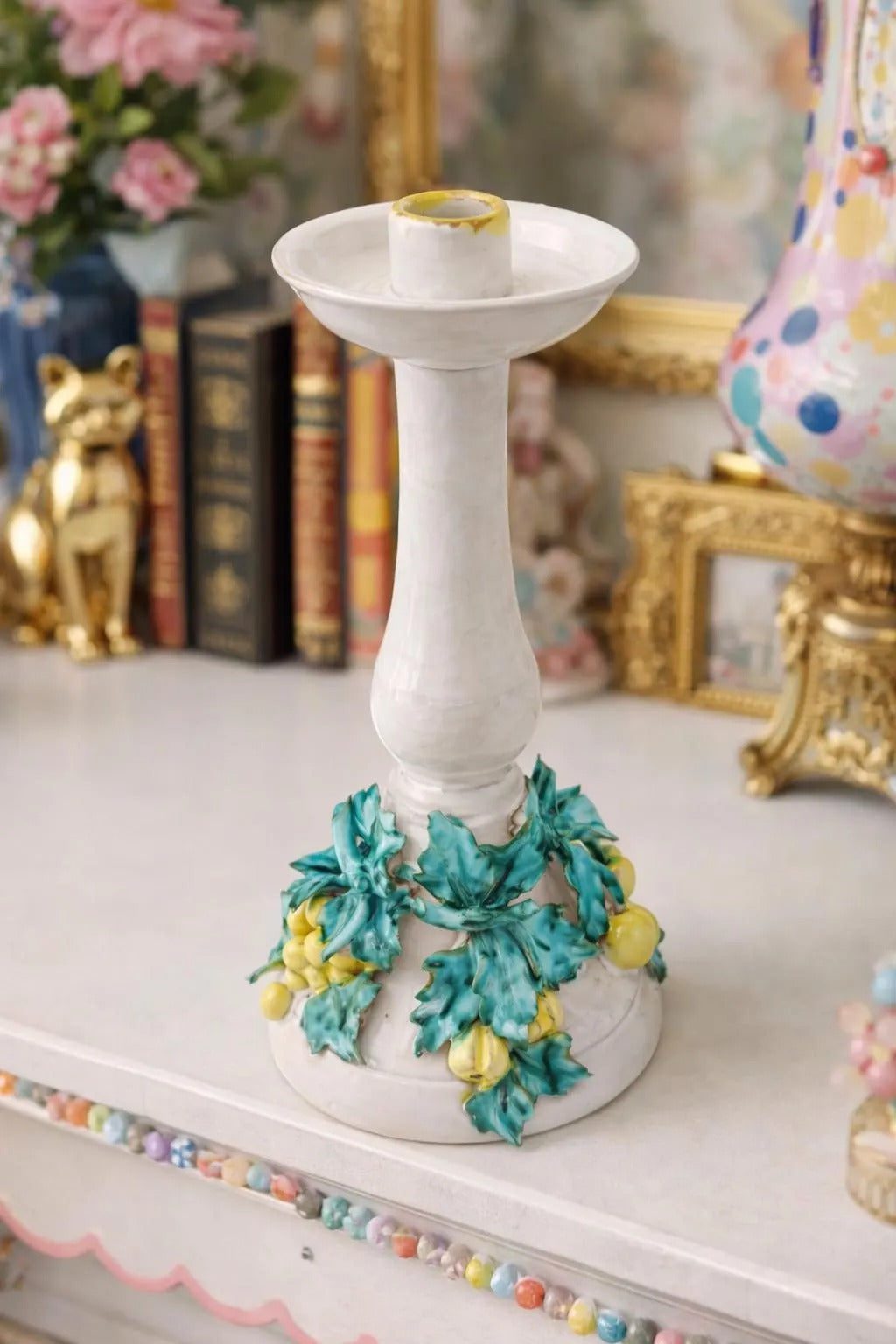 Tall vintage Italian ceramic candlestick featuring a colorful 3D fruit and leaf motif.