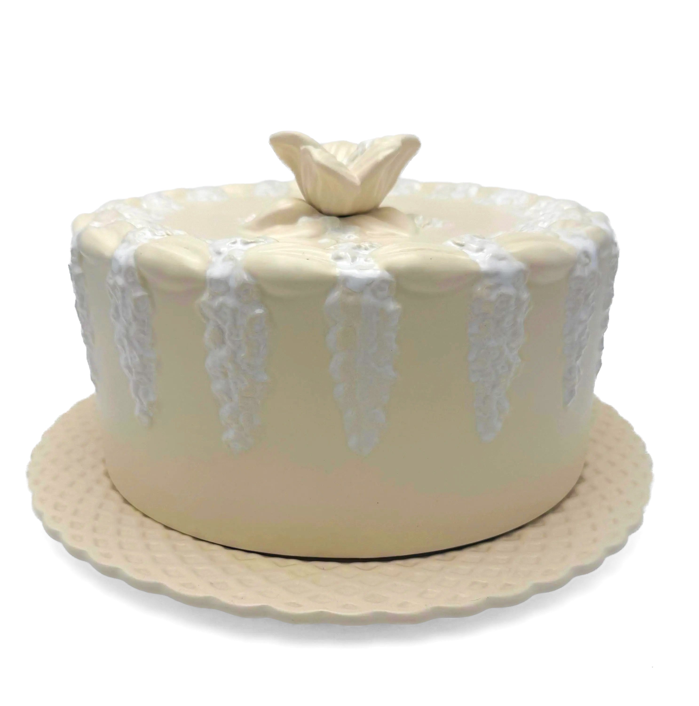 Large Portuguese earthenware dome and matching plate with a cream-white floral relief design.